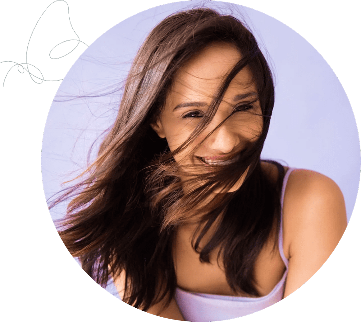 Woman laughing with hair in face