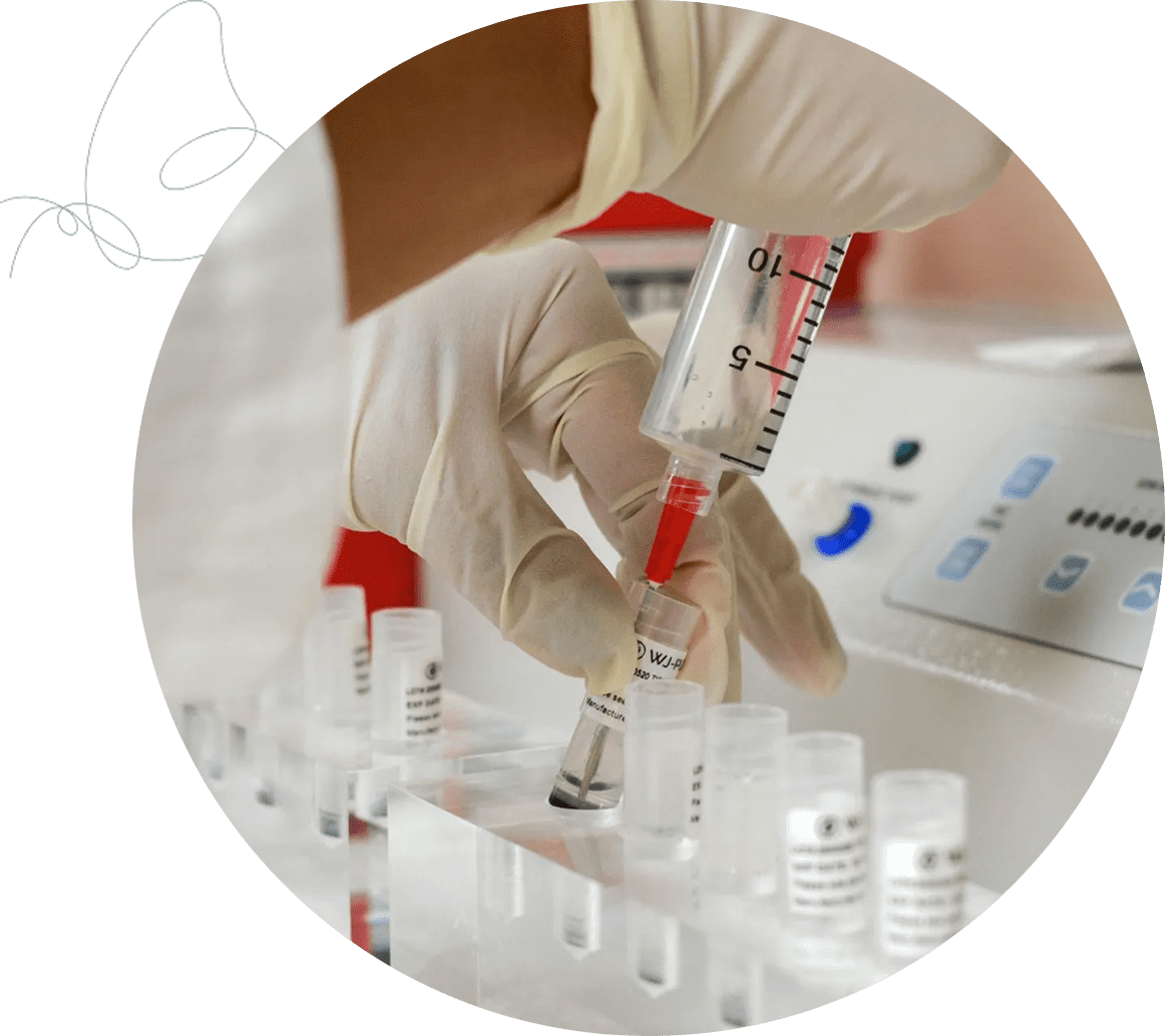 Scientist using syringe in laboratory