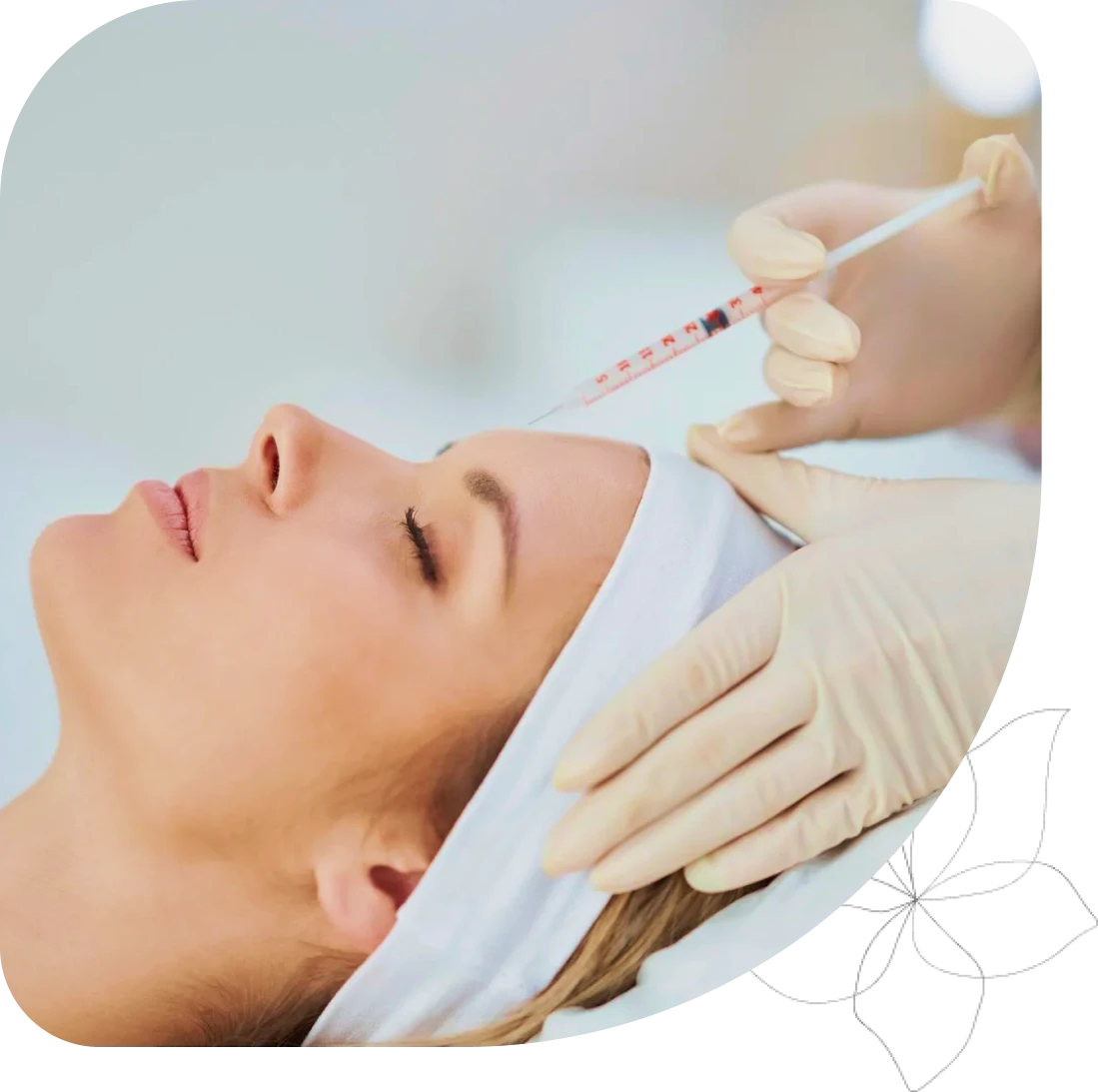 Woman receiving cosmetic injection in forehead